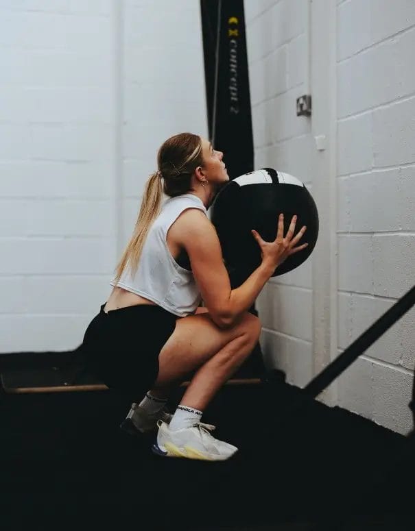 Woman working out with medicine ball